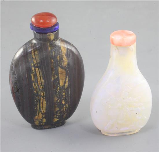 A Chinese carved opal snuff bottle and tigers eye mineral snuff bottle, early 20th century 6.5cm and 7.1cm